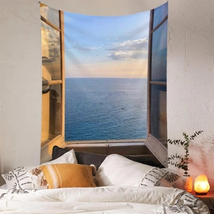 Detail view of Bohemian wall tapestry showing realistic ocean window landscape on bedroom wall