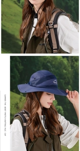 Detail of navy blue sun hat with breathable mesh and adjustable chin strap for hiking