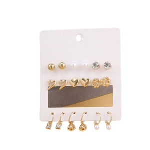 Set of 9 pairs golden alloy earrings featuring pearls, crystals, and floral heart designs
