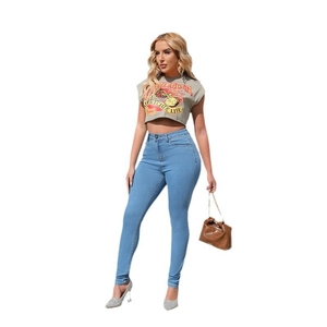Women's high waist skinny blue jeans paired with a grey cropped graphic t-shirt