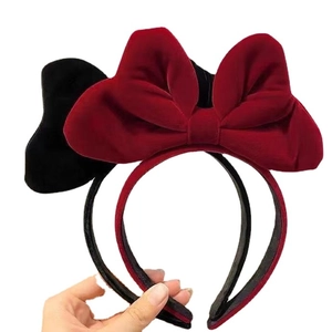 Elegant red and black velvet oversized bow headbands for festive and party styling