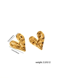 Macro shot of 18K gold plated heart earrings with hammered metal texture and dimensions