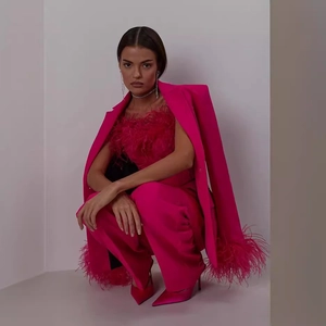 Magenta two-piece blazer set with ostrich feather trim and matching trousers for women