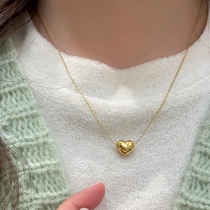 Minimalist gold heart pendant necklace in polished titanium steel for women's daily wear