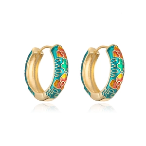 Detail of 18K gold plated hoop earrings with colorful floral enamel patterns