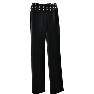 Close-up of high-waist straight-leg black trousers with white polka dot waistband detail