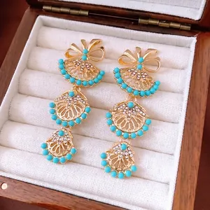 Boucles d'oreilles vintage dorées avec perles turquoise et strass brillants en éventail