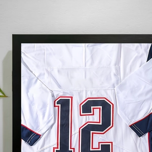 Close-up of number 12 jersey displayed in a minimalist black magnetic shadow box frame