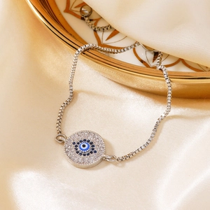 Classic silver Evil Eye bracelet with blue and white crystals on silk and ceramic