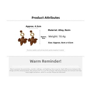 Detailed view of amber acetate flower earrings with gold hollow rings and dimensions