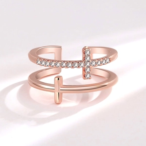 Rose gold double layer cross ring with cubic zirconia stones in a luxury minimalist style