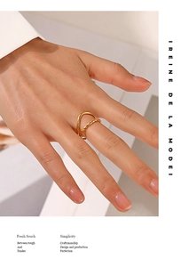 Detail of model wearing 18K gold plated adjustable stainless steel wave and rope rings