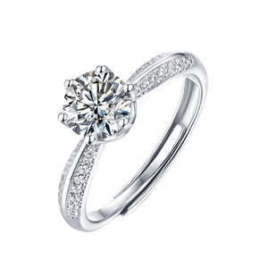 Macro detail of six-prong silver engagement ring with brilliant round cut cubic zirconia
