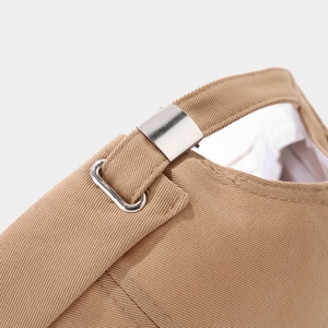 Detail of khaki twill brimless cap showing adjustable metal buckle and fine stitching
