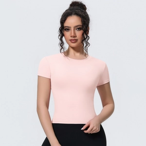 Detail of slim-fit pale pink athletic T-shirt with breathable crew neck for yoga