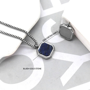Detail of square lapis lazuli pendant with detachable gem feature on a steel chain