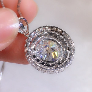 Macro detail of round cut crystal pendant necklace with sparkling micro-pave setting