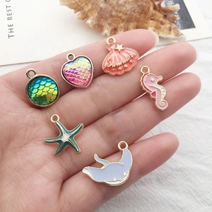 Enamel ocean charms set featuring mermaid, seahorse, and starfish pendants for DIY jewelry