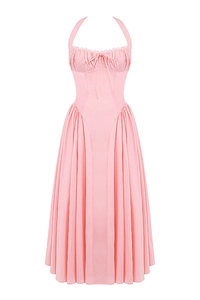 Detail of pink halter neck dress with drawstring bust and ruched waist texture