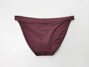 Detailed view of dark red low-waist ice silk panties with seamless cotton crotch lining
