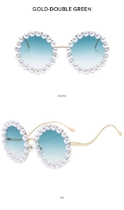 Detail of round gold sunglasses with pearl embellishment and green gradient lenses