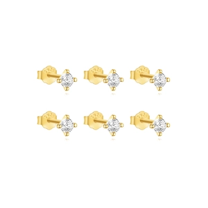 Macro detail of six gold-plated S925 silver stud earrings with round-cut crystals