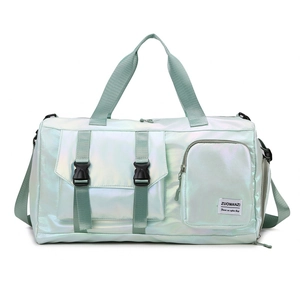 Macro detail of glossy light green travel bag showing buckle pocket and nylon texture