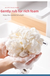 Detailed view of white PE bath loofah mesh sponge creating rich foaming bubbles