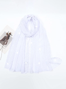 Detailed view of white chiffon shawl with elegant sparkling rhinestones and dried flowers