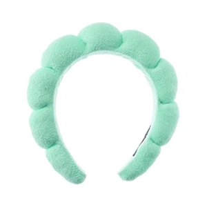 Detailed texture of light green cloud sponge headband for washing face and makeup