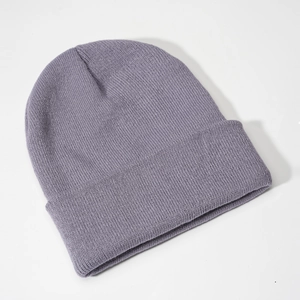 Detail view of the fine rib knit texture and wide cuff on this purple winter beanie hat