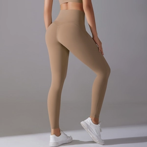 Rear view showing the high waist lift and seamless fit of these khaki yoga leggings