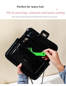 Mini green wide-tooth hair comb being placed into a small handbag for easy portability