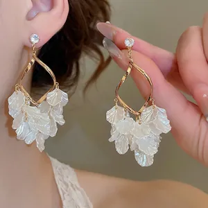 Golden drop tassel earrings with white layered petals and zircon stud for women