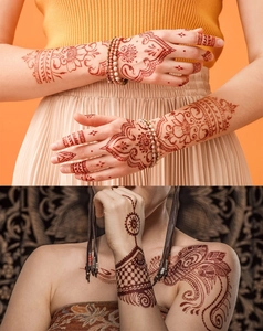 Detail of red-brown henna lace tattoo on hand and shoulder with intricate Indian pattern