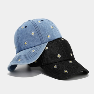 Stylish denim baseball caps with daisy embroidery in blue and black for outdoor sun protection