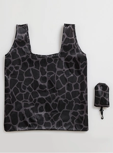 Detail view of foldable shopping bag and portable pouch with giraffe print and plastic hook