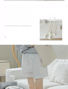 Detail of white rib-knit high socks and casual shorts in a minimalist lifestyle setting