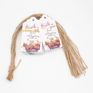 Detailed view of white paper thank you tags with watercolor succulent prints and jute twine