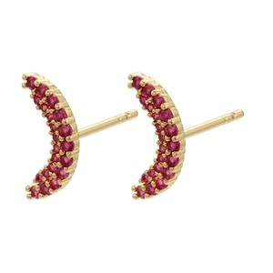 Close-up of gold moon stud earrings with micro-paved red cubic zirconia stones