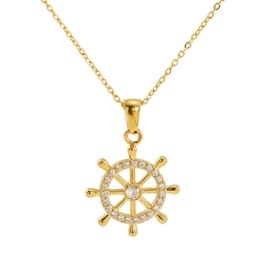 Close-up of golden ship wheel pendant necklace with sparkling white zircons