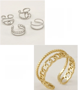 Detail of 18K gold plated stainless steel hollow ring showing lead-free polished finish