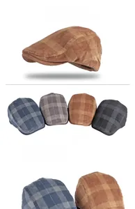 Detail of soft corduroy texture and plaid pattern on British style flat cap