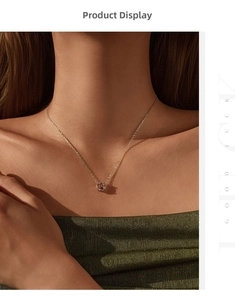 Close-up of a delicate rose flower pendant necklace in rose gold on a model neck