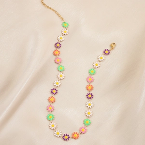 Colorful daisy choker necklace with enamel flowers on elegant champagne silk fabric