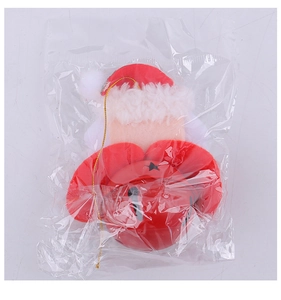 Christmas Santa doll ornament with small bell inside a clear protective OPP plastic bag