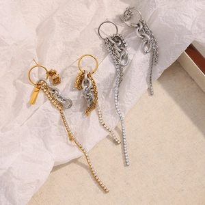 Detail of 18K gold and silver tassel earrings with shimmering cubic zirconia accents