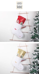 Close-up of unicorn Christmas stockings with colorful horns and sequined top detailing