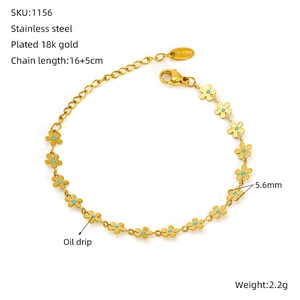 Detail of 18k gold plated flower bracelet with blue oil drip centers and lobster clasp