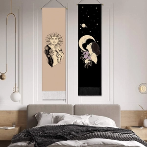 Bohemian moon and sun girl tapestries with fringes displayed in a cozy bedroom